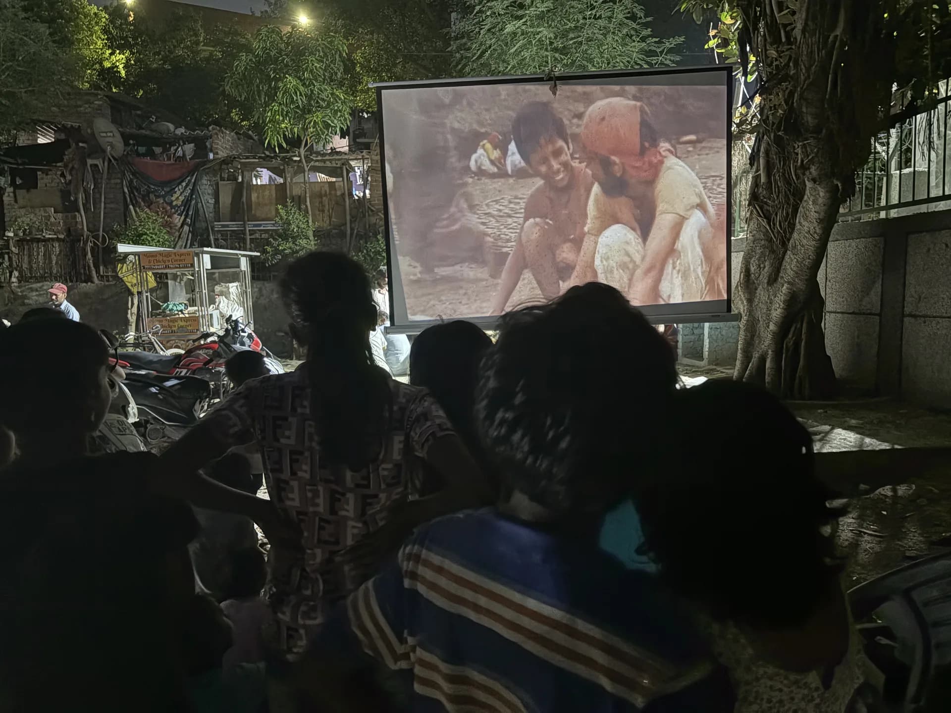 Children seated together, waiting for the film to begin